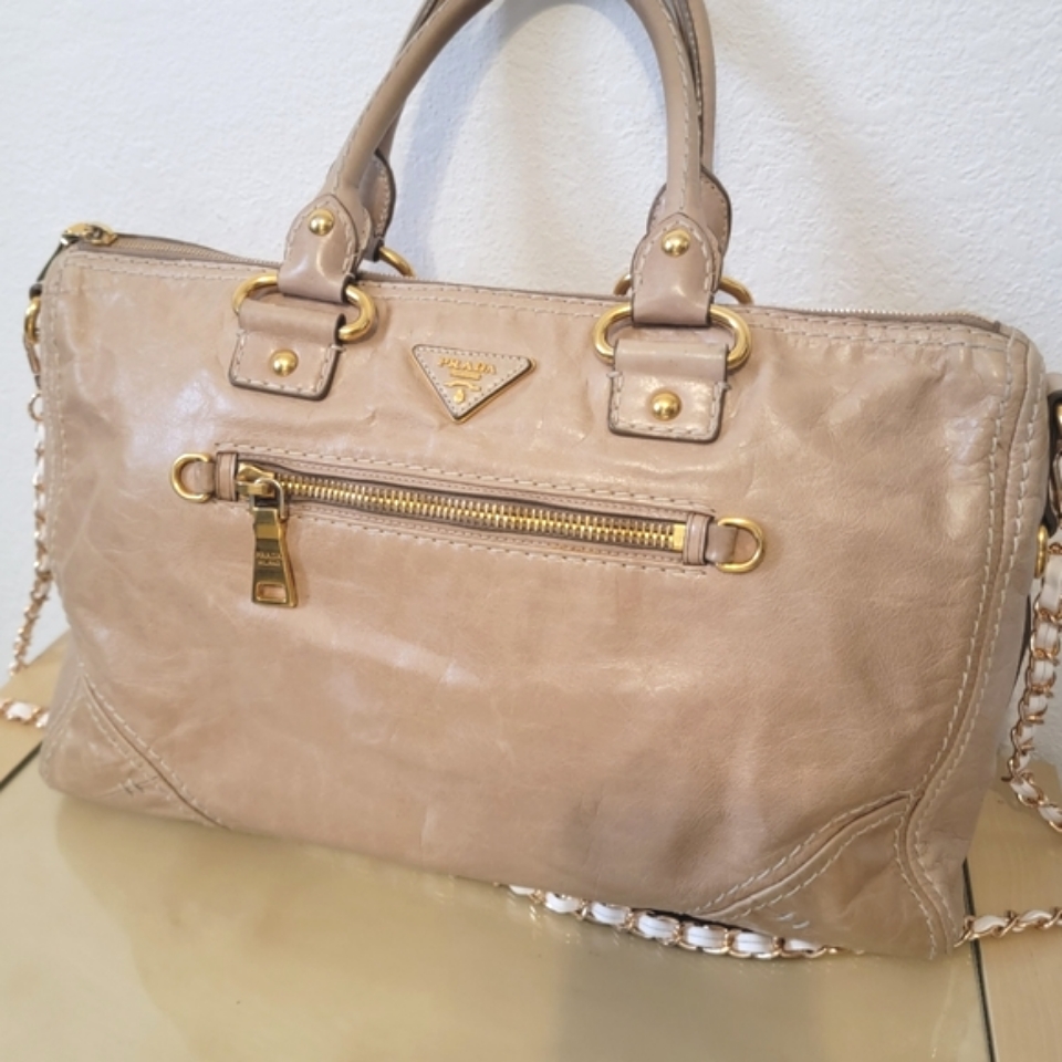 Prada Beige Leather Handbag With Gold Accents